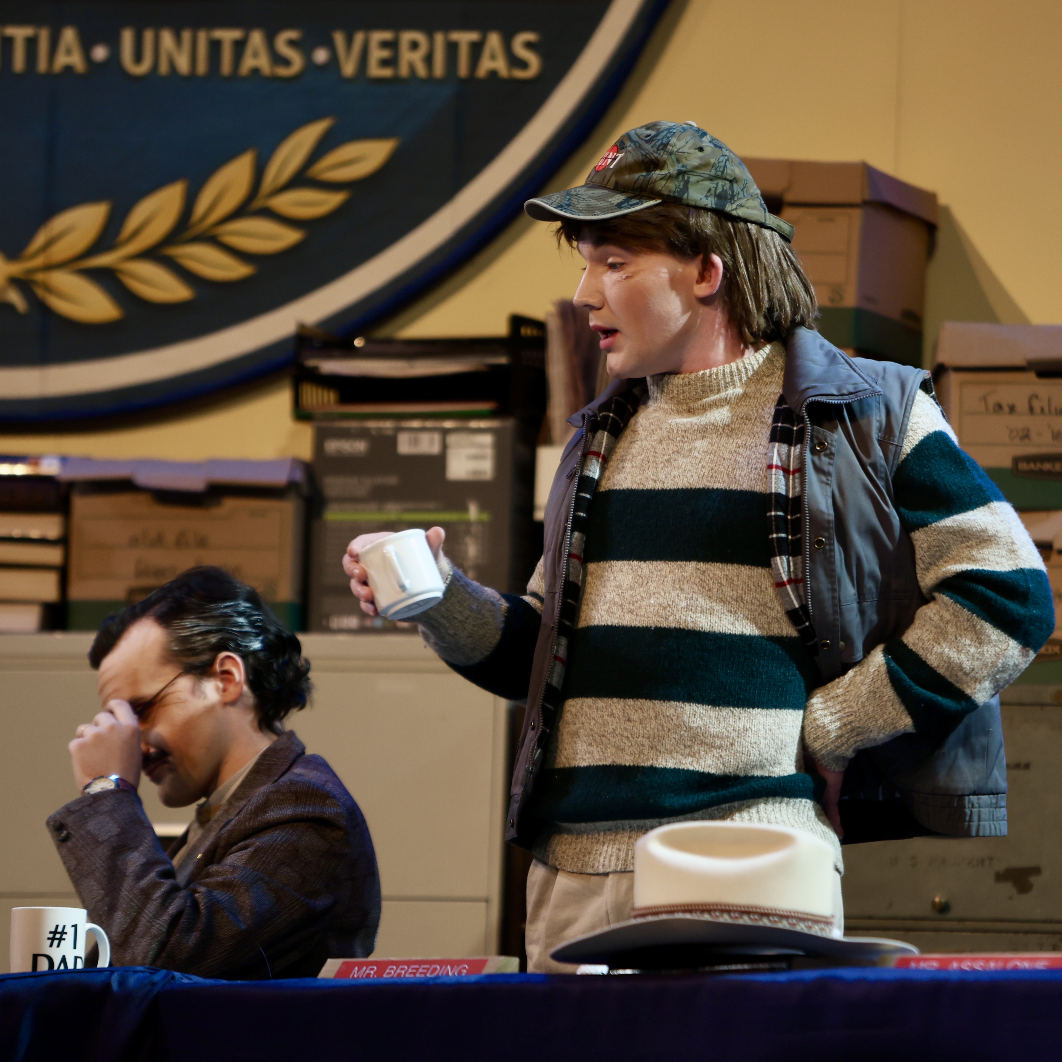 Brennan Gordon Metz holding a coffee cup in The Minutes